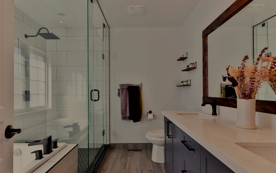 Bright renovated bathroom with custom tile and a floating vanity